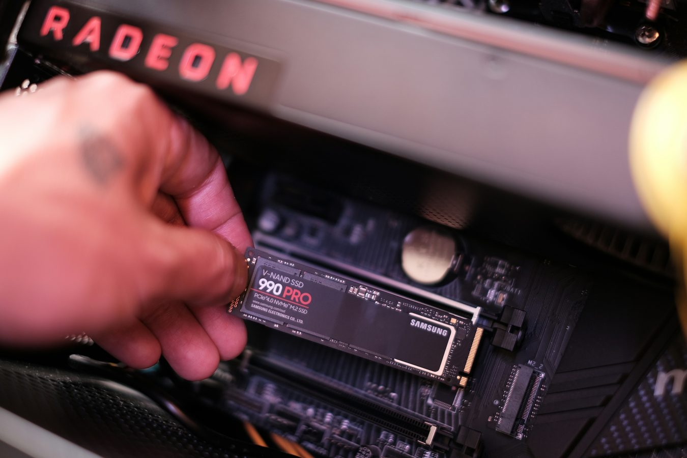 SSD being installed inside a desktop computer for an upgrade